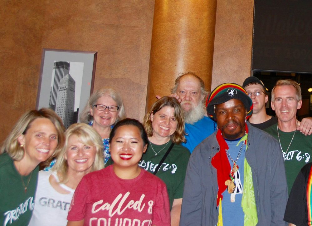 Volunteers and friends gathered together indoors