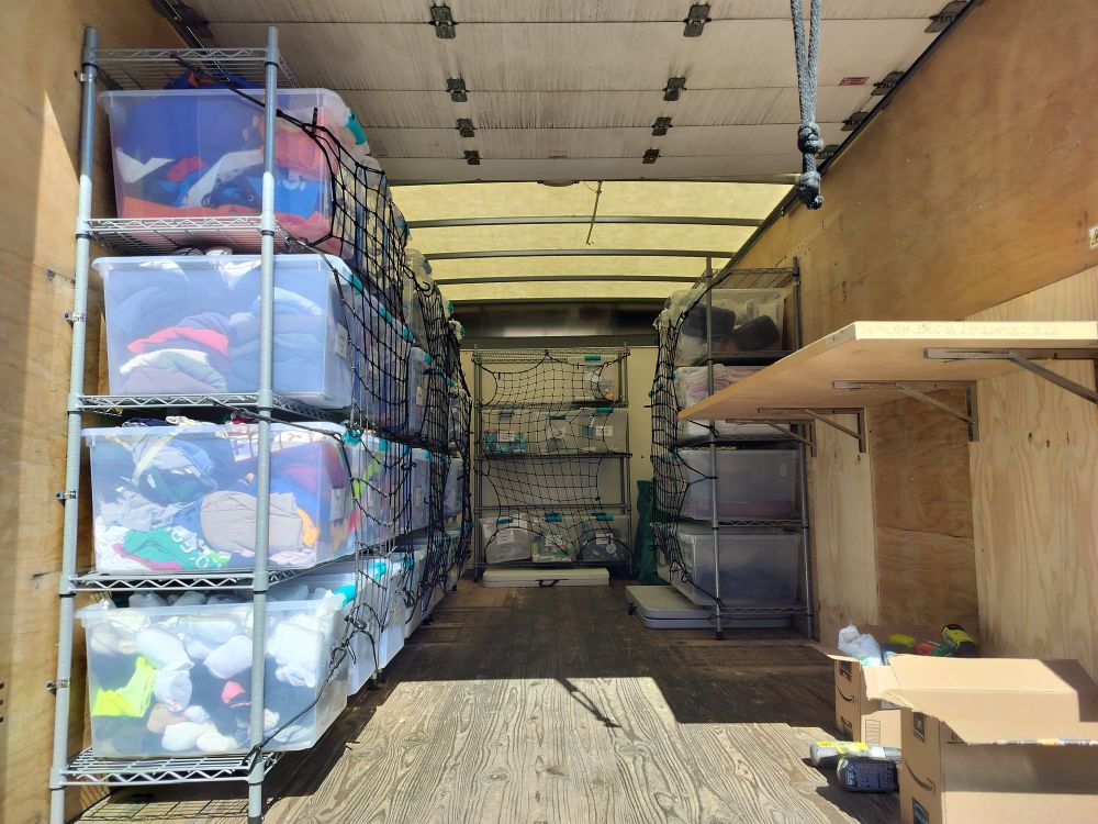 Inside the truck, fully outfitted with bins of donations